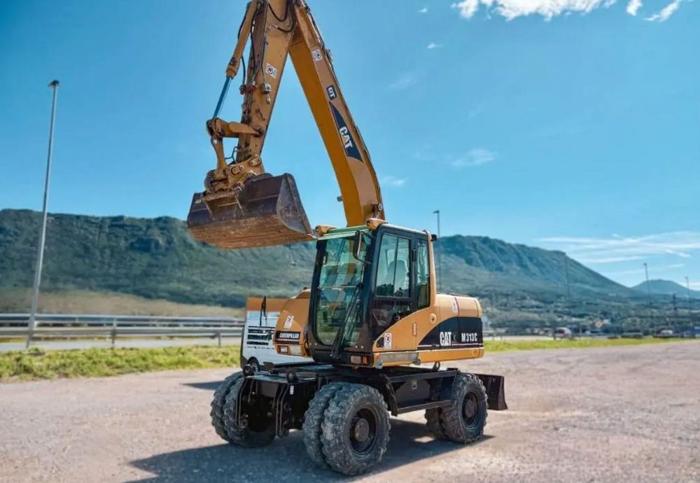 2006 CAT M 313 C - Triple Boom Versatility